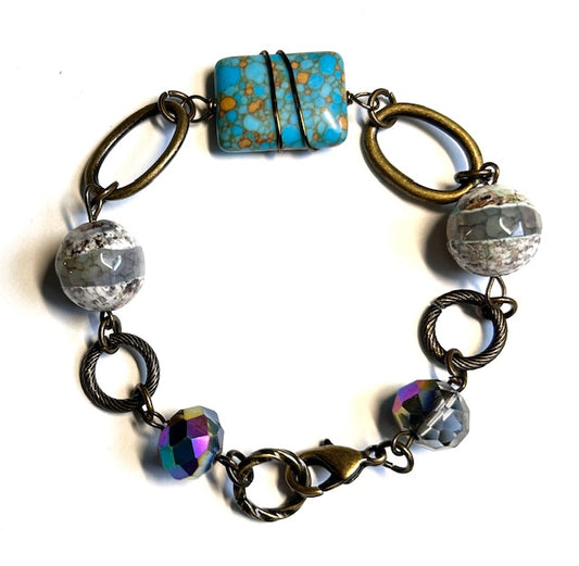 2582.   $20.  Brass/dzi/jasp